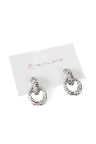 Silver hoop earrings on a white background with a visible brand name.