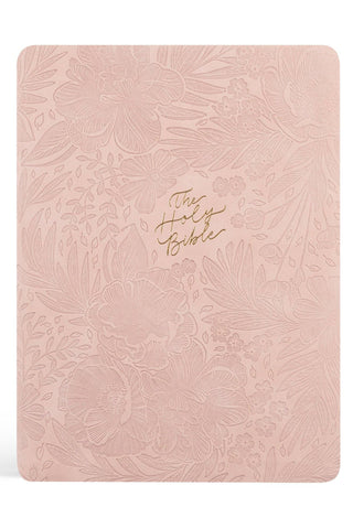 Pink floral embossed Bible with gold text on a white background