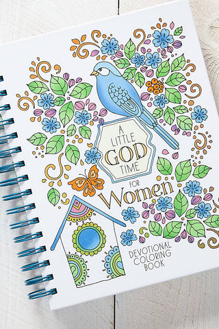 Coloring book titled 'A Little GOD Time for Women' with coloring supplies on a table.
