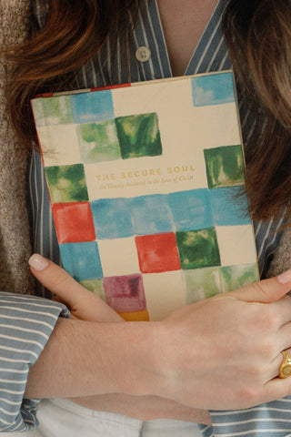 Person holding a book with a colorful cover