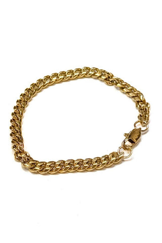 Gold chain bracelet on a white background