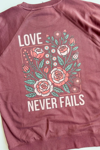 1 Corinthians Love Never Fails Crewneck