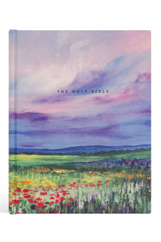 Cover of 'The Holy Bible' with a colorful landscape design on a white background
