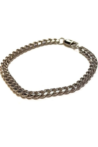 Silver chain bracelet on a white background